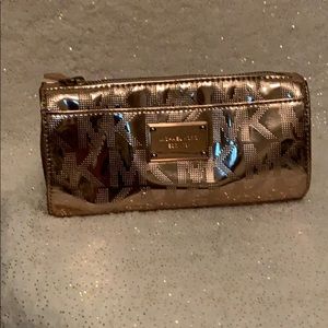 Metallic rose color makeup bag.